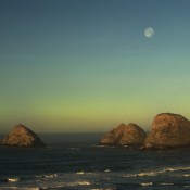 three rocks and moon